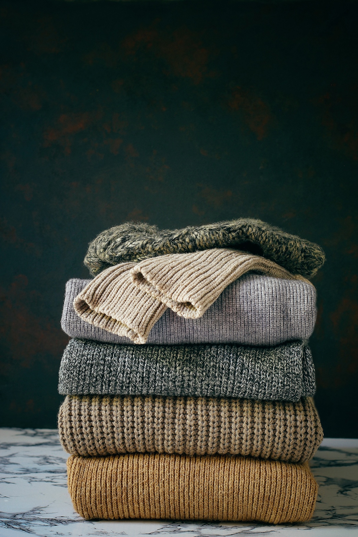 Stack of folded knitwear sweaters